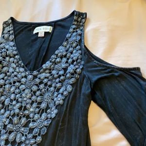 Long sleeve open shoulder blouse.